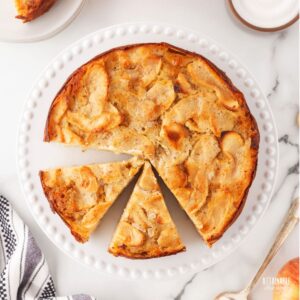 apple cake from above, with two wedges cut from the whole cake.