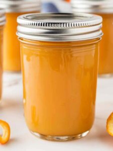 Jars of home canned orange jelly.